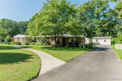 Ranch-style home with a front yard
