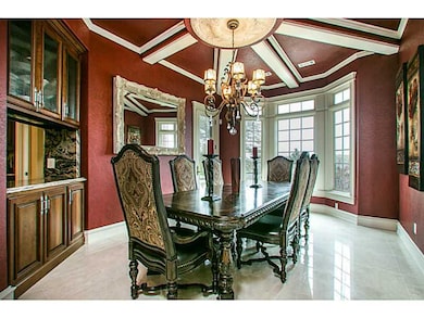 Dining Room. Stunning ceiling detail and natural light.  Don t miss the additional balcony space off dining.