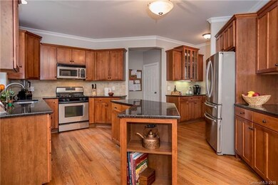 Open Kitchen with gorgeous cabinetry, storage galo