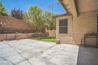 Fenced backyard with a patio area