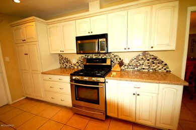 Kitchen with stove and pantry