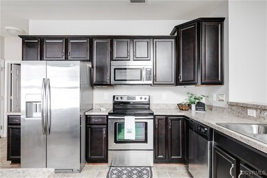 Beautiful Kitchen Featuring Dark Wood Cabinetry an
