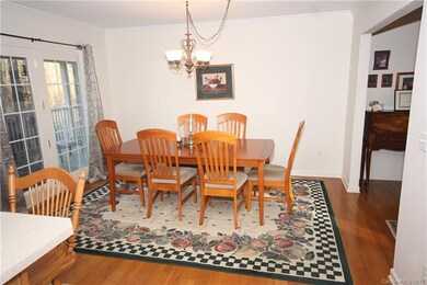 Dining area is open to kitchen and breakfast bar. 