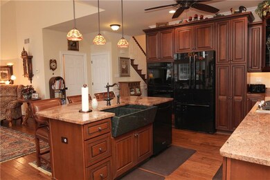 The center island boasts a stunning soapstone farm