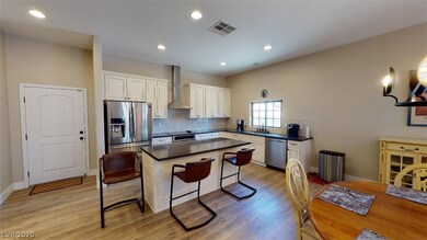 Complete open kitchen with breakfast sitting along