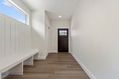 Mudroom with dark hardwood / wood-style floors and