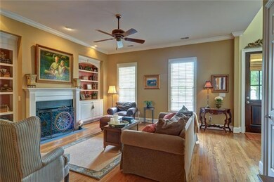 Spacious GREAT ROOM sports fresh designer paint.  HARDWOODS throughout most of main floor.  10