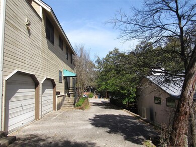 View of side of property with driveway and an att