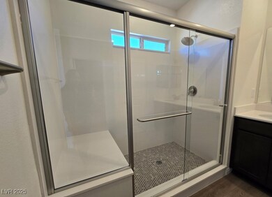 Full bathroom featuring a stall shower, wood finis