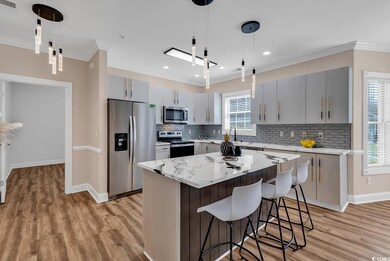 Kitchen featuring a center island, pendant lightin