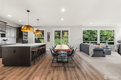 The open-concept great room provides a harmonious transition between the kitchen, dining, and living spaces—perfect for both everyday living and entertaining.