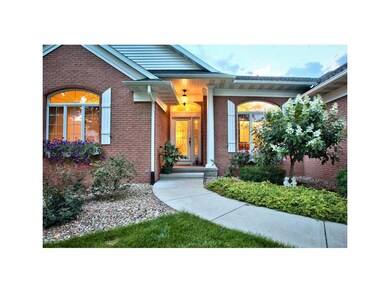 Front Exterior. COLUMN LEADING TO GLASS FRONT DOOR