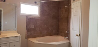 Master Bath soaking tub with Ceramic Tile.