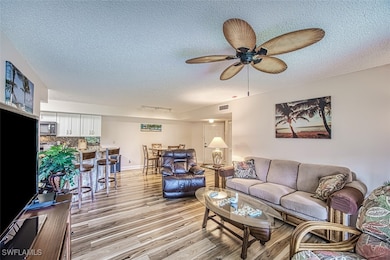 Living room open to kitchen and dining area