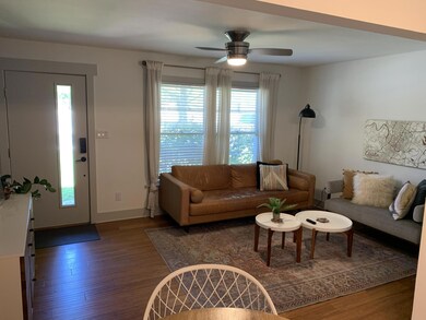 Living room featuring wood finished floors, ceili