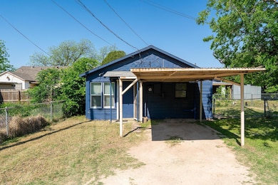 View of front of home featuring dirt driveway, a f