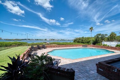 Gorgeous pool surrounded by brick pavers.