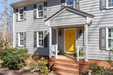 Dental molding accents the brick  front stoop and