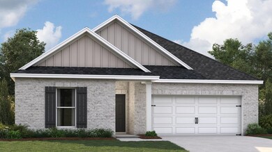 View of front facade with a garage and a front law
