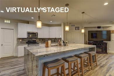 Kitchen with appliances with stainless steel finis
