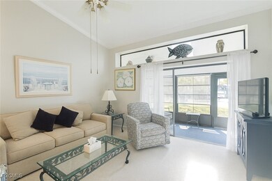 Living area featuring crown molding, vaulted ceiling, and ceiling fan