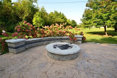 The backyard has a hot tub, fire pit, stamped concrete patio and a new 450 sq ft wood deck.