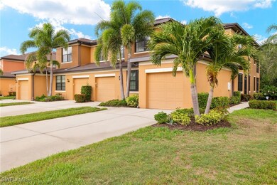 View of property with driveway, stucco siding, an