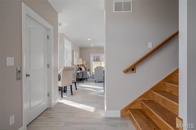Walk in to the foyer that leads you in to the Kitchen. Elevator to the left staircase to the right.