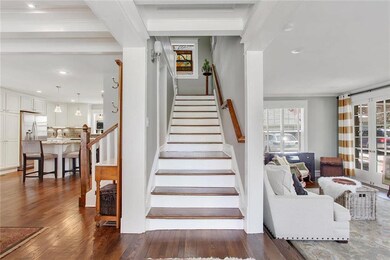 What a beautiful entry with split stair case and v