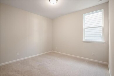 Unfurnished room featuring carpet flooring.*Pictur