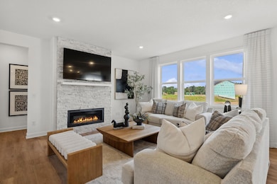(Photo of model home, finishes will vary) It’s shown here with an optional center fireplace to add a warm glow
