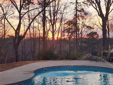 View of pool at dusk