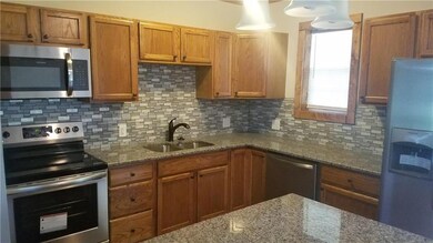 Kitchen with granite counters and stainless applia