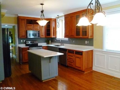 Kitchen - Open kitchen with wood floors, island, s