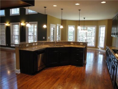 Great open kitchen with upgraded gas stove and shelving in cabinets and pantry!
