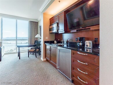 Kitchen featuring a wall of windows, dishwashing m