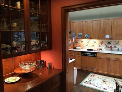 Kitchen looking through butler pantry area.