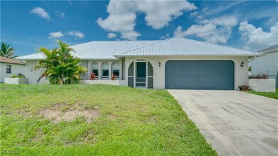 View of front of home featuring stucco siding, an attached garage, driveway, and a front lawn