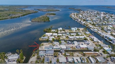Aerial view featuring a water view and a residenti