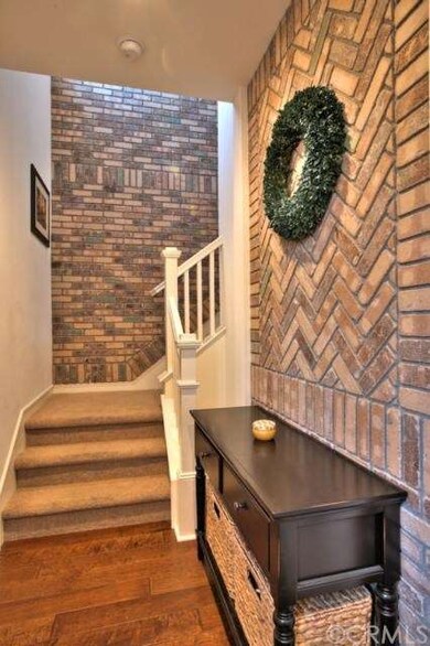 Wood Floor and Brick Entry from your Private Attac