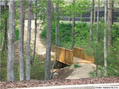 Walking path with bridge leads to the tennis court