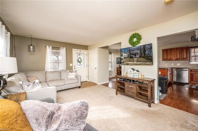 Living Room Opens to Dining Room and Kitchen