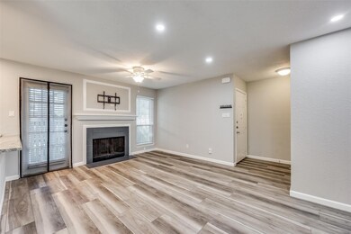 Unfurnished living room featuring ceiling fan, a f