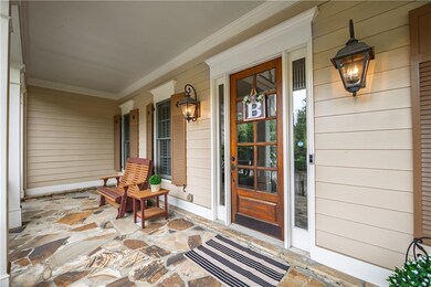 Property entrance featuring covered porch
