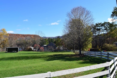 Side yard looking towards bridge to Monroe NH