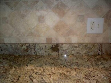 Kitchen. Beautiful granite counters and tiled back