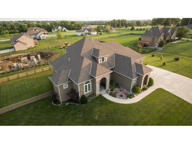 Drone View of Home and large corner fenced lot!