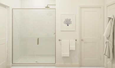 Primary bath with glass shower enclosure