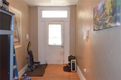 Laminate wood look spacious entry to Unit 1