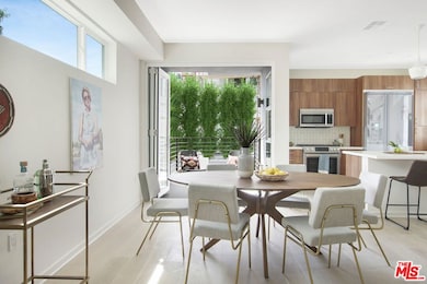 Bright dining area with adjace